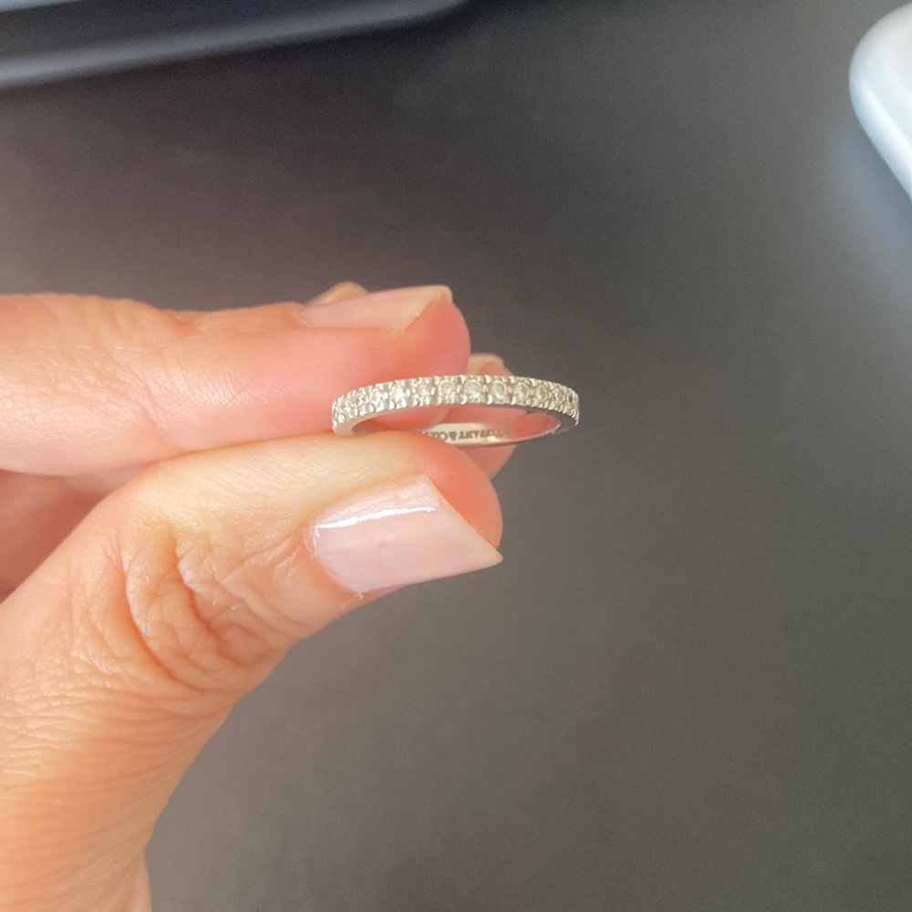 Authentic Tiffany platinum wedding band with small diamonds; size 4.5